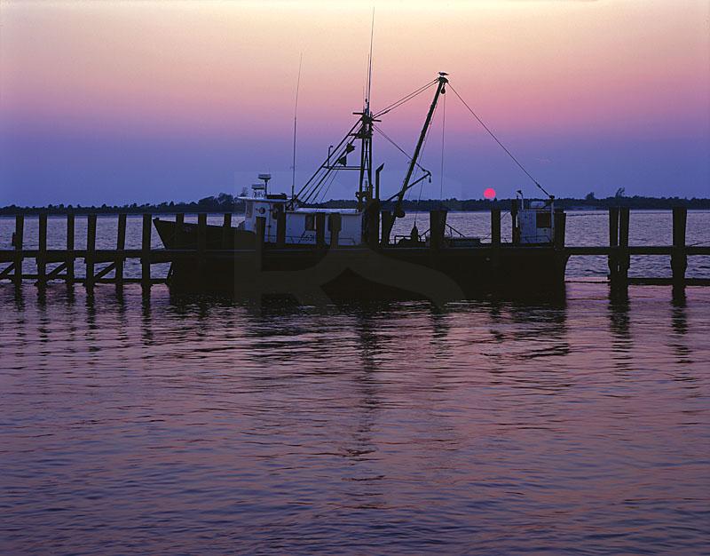 Commercial Fishing Boat At Sunset