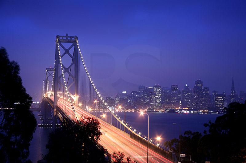 Oakland Bay Bridge And San Francisco Skyline At Dawn